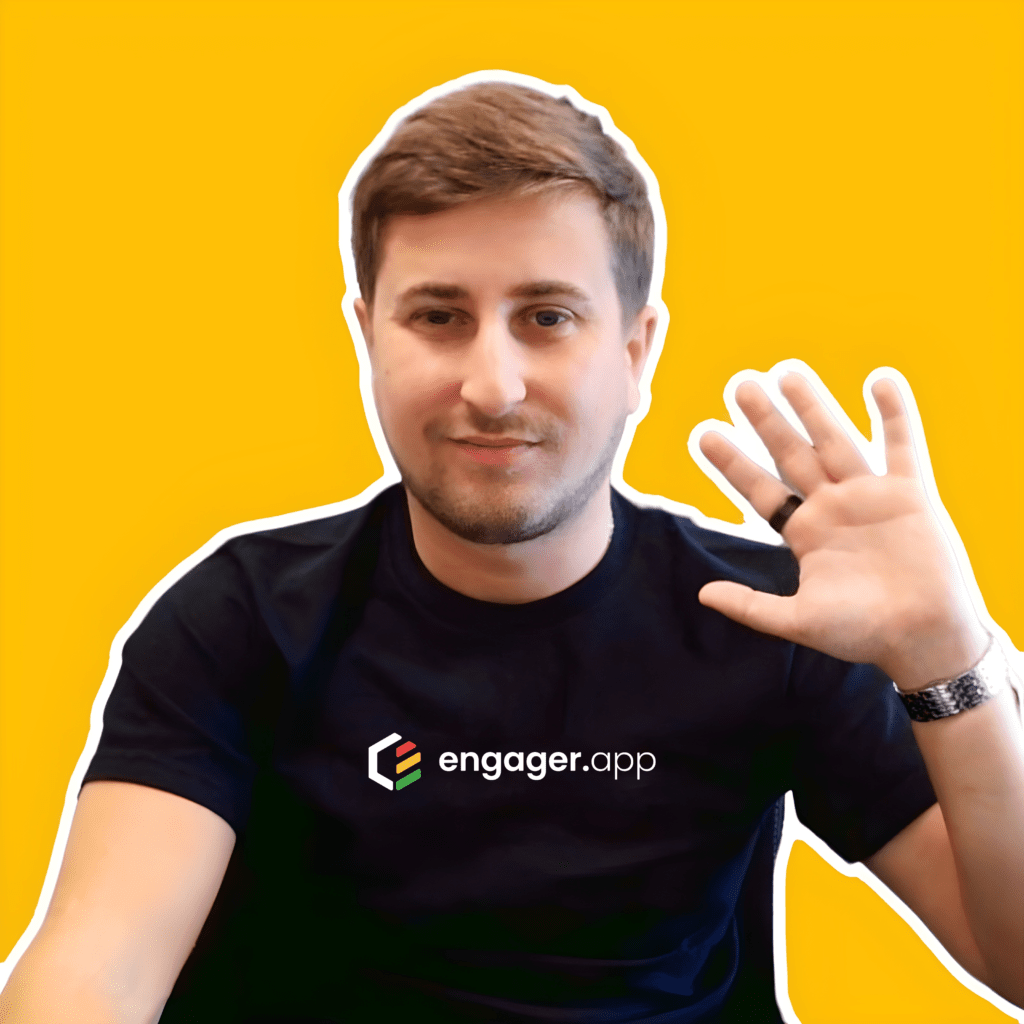 A person with short brown hair is smiling and waving at the camera. They are wearing a black t-shirt with the logo and text engager.app. The background is bright yellow.