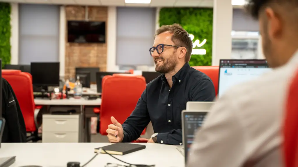 Sam Tasker-Grindley of Nexus talking in an office