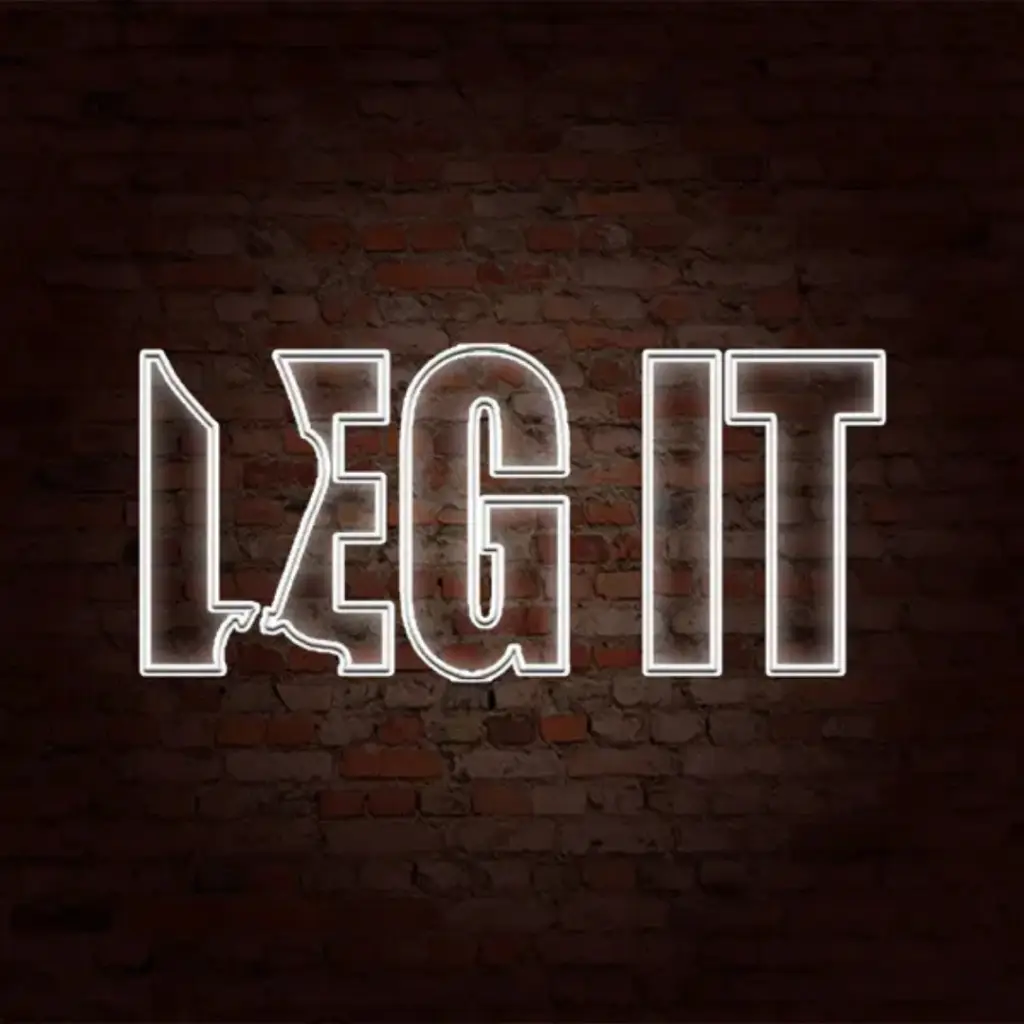 Leg It in white neon letters on a brick wall